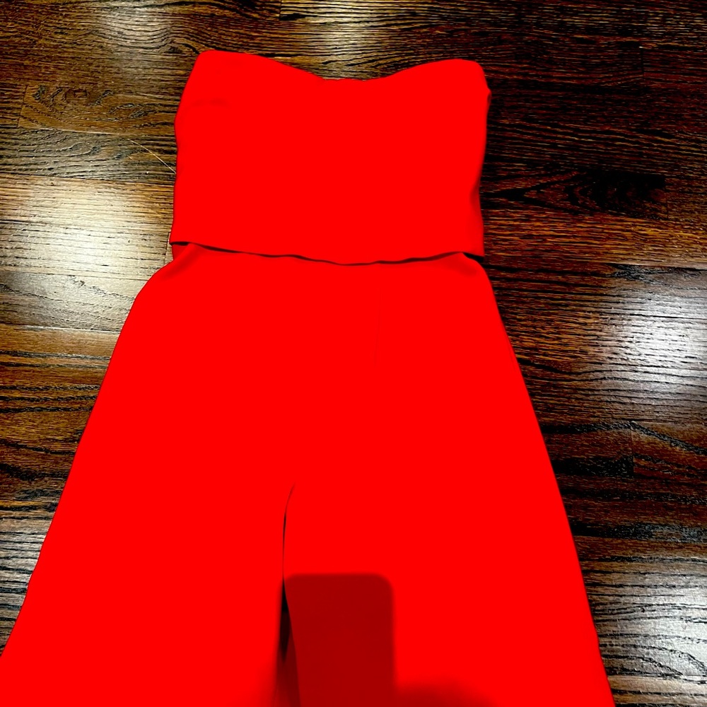 Strapless wide legged jumpsuit with open back and sexy strap closure